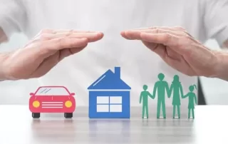 Homeowner, auto and personal insurance under hands representative of insurance protection.